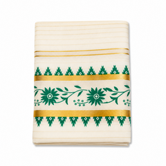 A close-up folded view of an off-white Kerala tissue cotton kasavu set mundu centered on a solid white background, showcasing a horizontal green floral vine motif framed by gold zari bands and green temple edge borders. Available in the UK at theindianshelf.co.uk.