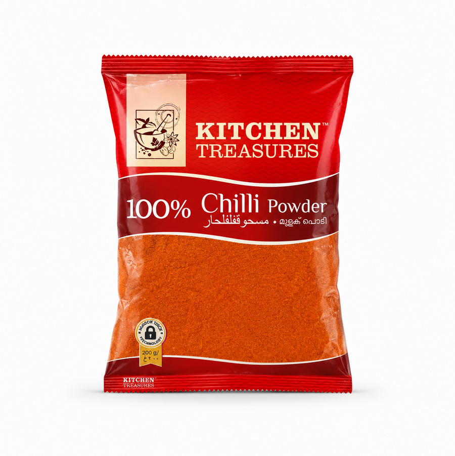 A professional product shot of a 200g retail pouch of Kitchen Treasures 100% Chilli Powder from image_8f2262.jpg. The red and silver packaging features a traditional mortar and pestle brand logo graphic above a large, transparent window showcasing the fine, rust-red chili powder inside.