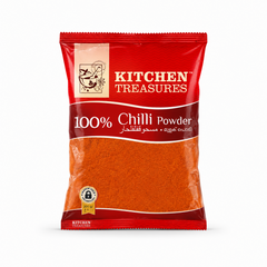 A professional product shot of a 200g retail pouch of Kitchen Treasures 100% Chilli Powder from image_8f2262.jpg. The red and silver packaging features a traditional mortar and pestle brand logo graphic above a large, transparent window showcasing the fine, rust-red chili powder inside.