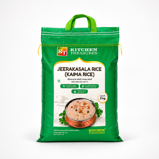 A professional studio shot of a large 5 kg woven sack of Kitchen Treasures Jeerakasala Rice (Kaima Rice) The packaging features a striking green color scheme with a built-in green fabric carrying handle at the top. The bold white "KT Kitchen Treasures" stamp logo is displayed near the top left. The central white label features the product name in large brown lettering along with its Malayalam translations, This product is available in the UK at theindianshelf.co.uk.