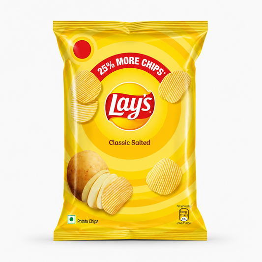 A professional studio product shot of a bright yellow pillow pack of ridged Lay's Classic Salted Potato Chips against a solid white background. The top center displays a semi-circular red banner reading "25% MORE CHIPS"* arching over the circular yellow and red "Lay's" brand logo. Below the logo, the product title "Classic Salted" is clearly printed in dark brown script.This product is available in the UK at theindianshelf.co.uk.