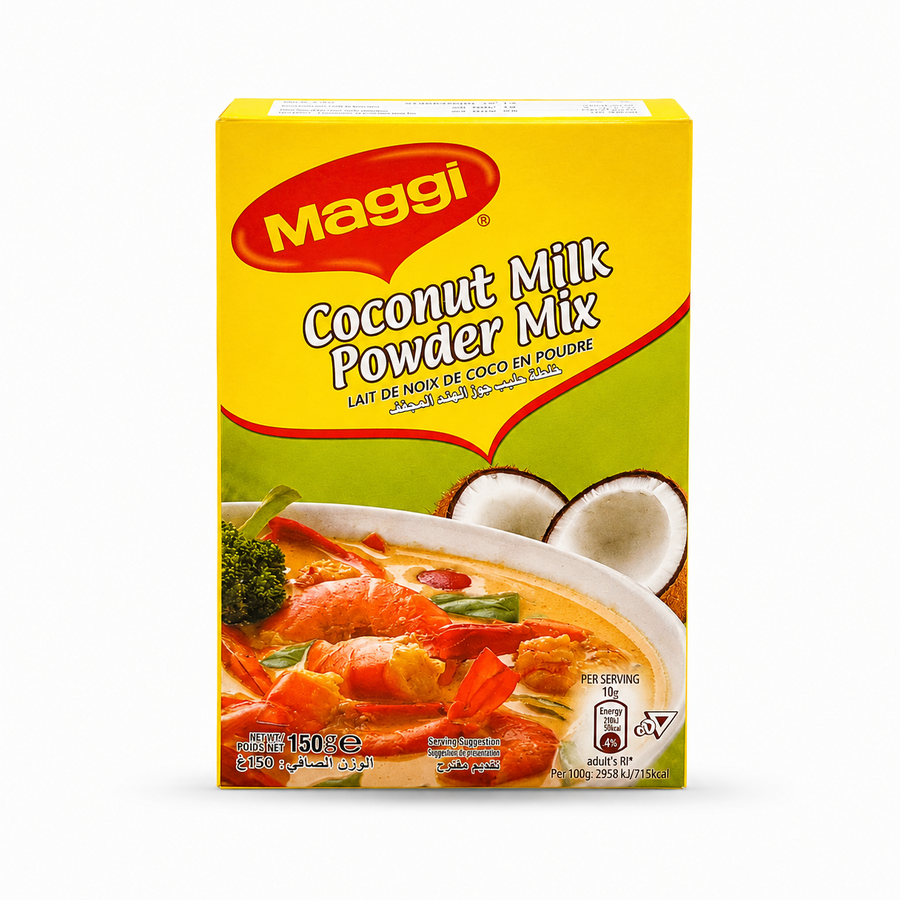 A studio product shot of a 150g cardboard box of Maggi Coconut Milk Powder Mix isolated against a pure white background in image_817f24.jpg. The bright yellow and green retail packaging features the red Maggi logo alongside a steaming bowl of rich coconut-based prawn curry next to sliced coconuts.