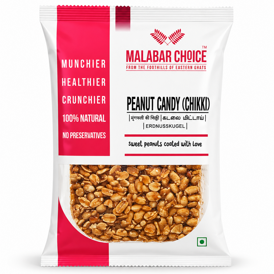 A professional studio shot of the Malabar Choice Peanut Candy (Chikki) packaging  The bag features a clean white design with a bold vertical pink stripe on the left containing the words "MUNCHIER," "HEALTHIER," "CRUNCHIER," "100% NATURAL," and "NO PRESERVATIVES." The red "Malabar Choice" logo is at the top right. A central transparent window reveals the glossy, golden-brown peanut brittle inside, showing whole peanuts packed closely together. This product is available in the UK at theindianshelf.co.uk.