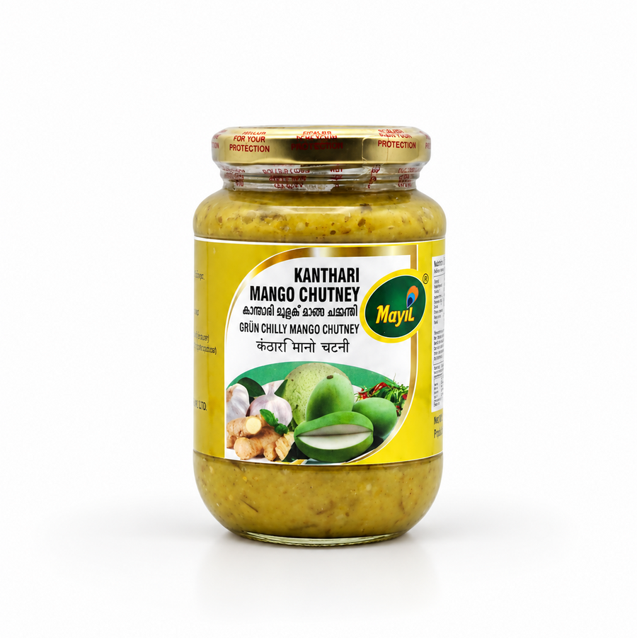 A glass jar of Mayil Kanthari Mango Chutney featuring a gold safety-sealed cap and a yellow-and-white product label with raw mango illustrations, centered on a solid white background. Available in the UK at theindianshelf.co.uk.