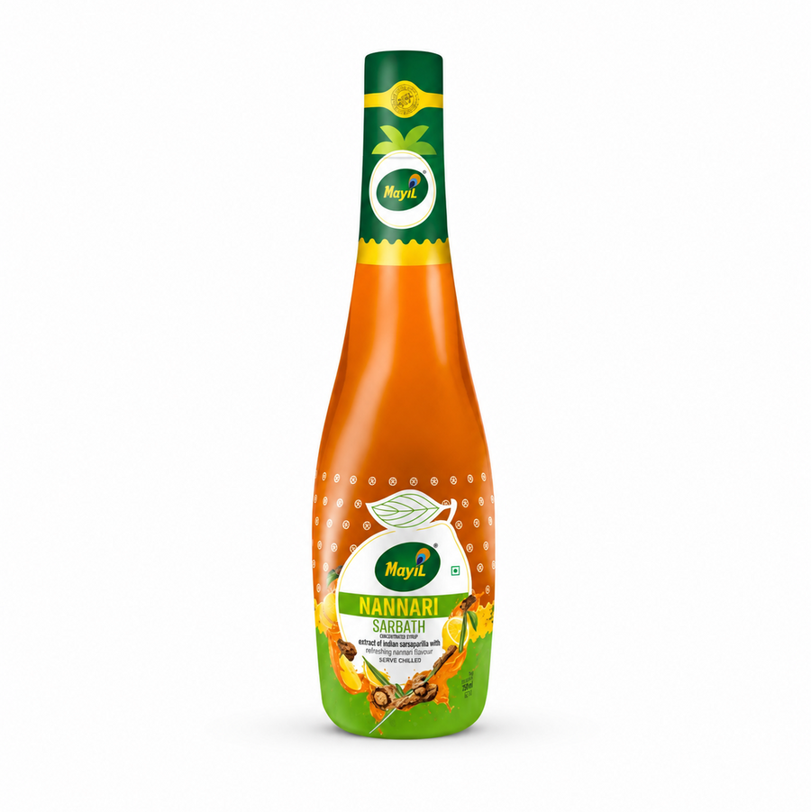 A professional studio product shot of a contoured bottle of Mayil Nannari Sarbath concentrated syrup against a solid white background. The bottle has a long dark green neck featuring a small circular peacock feather "Mayil" logo, transitioning down into a bright amber-orange body filled with liquid concentrate. The main central label displays the brand name "Mayil" inside a white circle,This product is available in the UK at theindianshelf.co.uk.