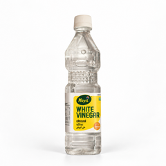 A 500ml clear plastic bottle of Mayil White Vinegar featuring a white cap and yellow-and-white product label, centered on a solid white background. Available in the UK at theindianshelf.co.uk.
