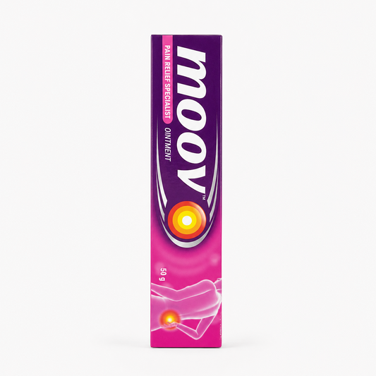 A professional studio shot of a vertically oriented rectangular cardboard carton of Moov Pain Relief Specialist Ointment The upper half of the box features a deep purple background showcasing the large, iconic white "moov" brand name written vertically with sleek silver crescent accents. To the left of the logo, a bright pink capsule graphic displays the words "PAIN RELIEF SPECIALIST" alongside the text "OINTMENT" in white. This product is available in the UK at theindianshelf.co.uk.
