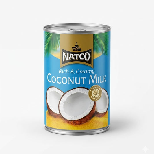 A can of Natco Rich & Creamy Coconut Milk, featuring premium quality coconut extract perfect for adding a smooth, velvety texture to curries, desserts, and soups, is available for purchase at theindianshelf.co.uk.