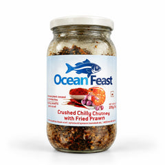 A 200g glass jar of Ocean Feast Crushed Chilly Chutney with Fried Prawn featuring product branding and a white cap, centered on a solid white background. Available in the UK at theindianshelf.co.uk.