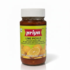 This image features a glass jar of Lime Pickle from the Priya brand, standing against a white background. The pickle itself is a reddish-brown color, visible through the clear glass, containing pieces of diced lime. The jar has a white, ribbed plastic cap. The label is bright yellow and green, with the brand name Priya prominently displayed in red. The product full name is listed as Lime Pickle (Pickled Diced Lime) with Lime Juice (Without Garlic). The weight is clearly printed at the bottom of the label as