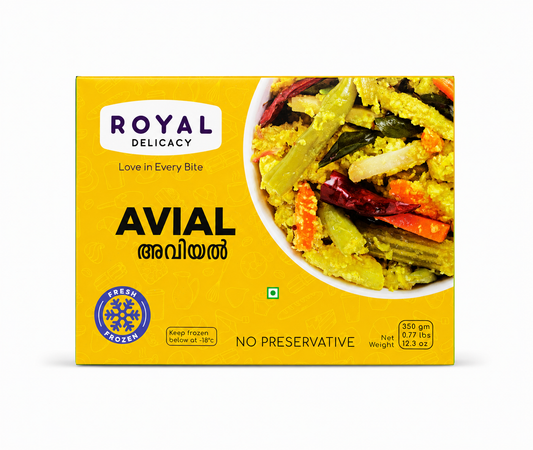 A professional studio product shot of a square yellow cardboard box for Royal Delicacy Frozen Avial against a solid white background. The main front face features a bright yellow background patterned with subtle white line illustrations of food items. In the upper left corner sits a white rounded rectangle logo displaying the brand name "ROYAL DELICACY" above the tagline "Love in Every Bite".This product is available in the UK at theindianshelf.co.uk.