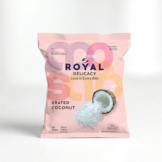 A 400g family value pack of Royal Delicacy Grated Coconut. The packaging features a vibrant green and blue design with an image of freshly grated coconut piled into a half-shell, highlighting its "Fresh & Natural" quality. It is a frozen raw ingredient, perfect for traditional South Indian curries, chutneys, and desserts.

This product is available for purchase in the UK at theindianshelf.co.uk.