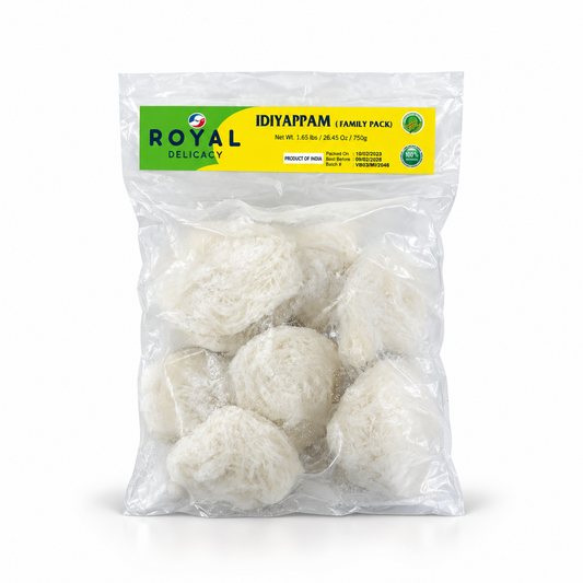 A 750g clear transparent pouch of Royal Delicacy Idiyappam Family Pack featuring a green header label and visible string hopper bundles, centered on a solid white background. Available in the UK at theindianshelf.co.uk.