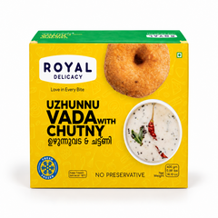 A 400g yellow retail box of Royal Delicacy Uzhunnu Vada with Chutney featuring serving imagery and branding, centered on a solid white background. Available in the UK at theindianshelf.co.uk.