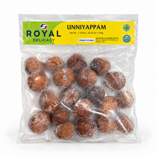  A transparent 750g bag of Royal Delicacy frozen Unniyappam featuring a yellow and green header label, centered on a solid white background. Available in the UK at theindianshelf.co.uk.