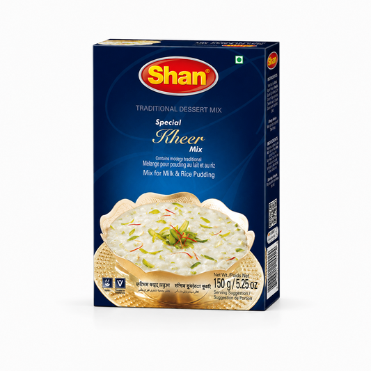 A 150g box of Shan Special Kheer Mix centered on a solid white background, featuring a deep blue box design with the red and yellow Shan logo and a serving suggestion showing a decorative metallic bowl filled with rich rice pudding topped with slivered pistachios and saffron threads. This product is available in the UK at theindianshelf.co.uk.