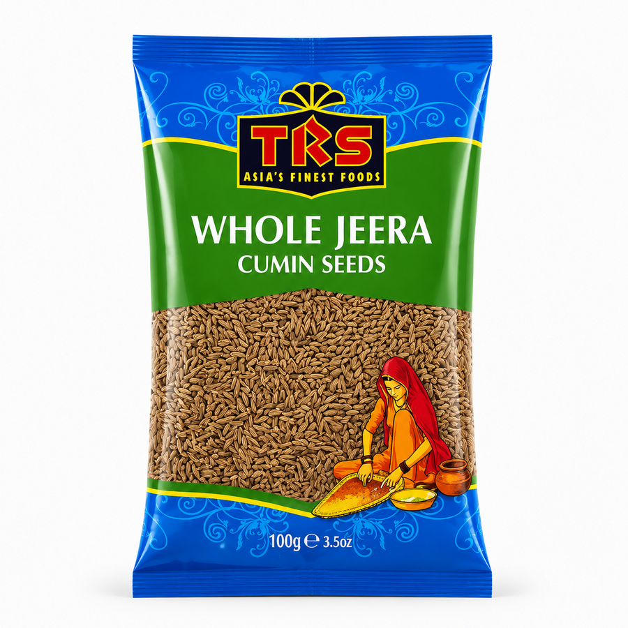 A 100g pouch of TRS Whole Jeera Cumin Seeds centered on a solid white background, featuring a vibrant green and blue packaging design with the TRS logo and a clear window showing whole cumin seeds next to an illustration of a traditional Indian woman. This product is available in the UK at theindianshelf.co.uk.