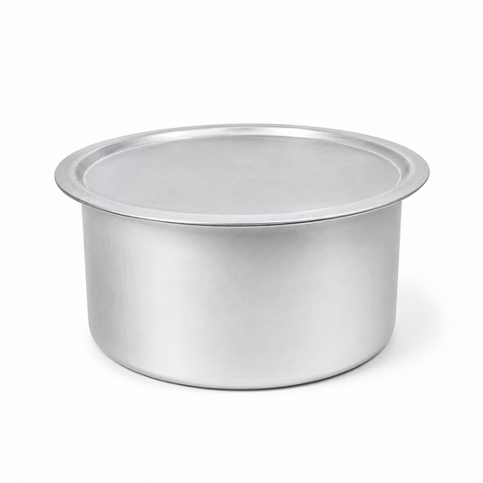 A professional studio product shot of a silver-colored traditional aluminium Biryani Chembu complete with its matching flat lid, isolated against a pure white background in image_a45dec.jpg. The heavy-duty metallic pot features a wide-rimmed, cylindrical silhouette with a clean brushed finish, captured under balanced studio lighting for a premium culinary presentation. This product is available in the UK at theindianshelf.co.uk.