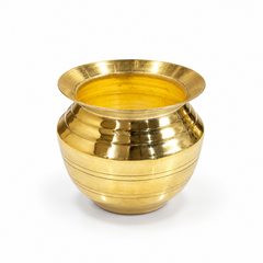  A traditional polished brass chombu pot featuring a flared rim and etched line details, centered on a solid white background. Available in the UK at theindianshelf.co.uk.