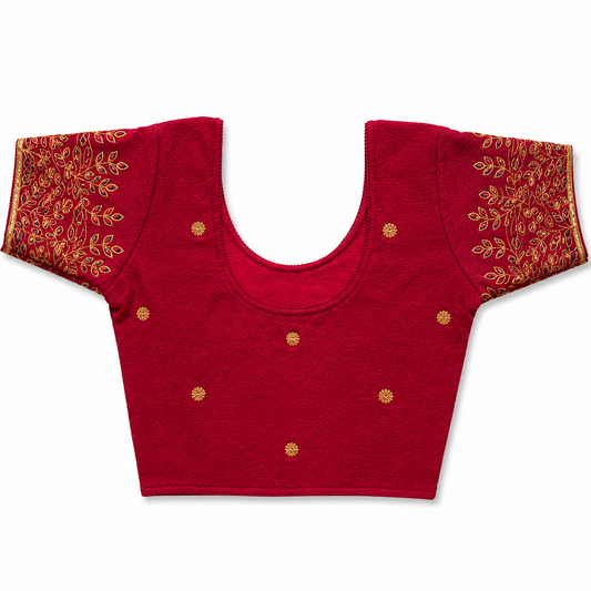 A colorful floral print readymade stretchable saree blouse displayed flat on a solid white background, featuring short sleeves, a scoop neck, and a vibrant pattern of pink, orange, and purple flowers. Available in the UK at theindianshelf.co.uk.