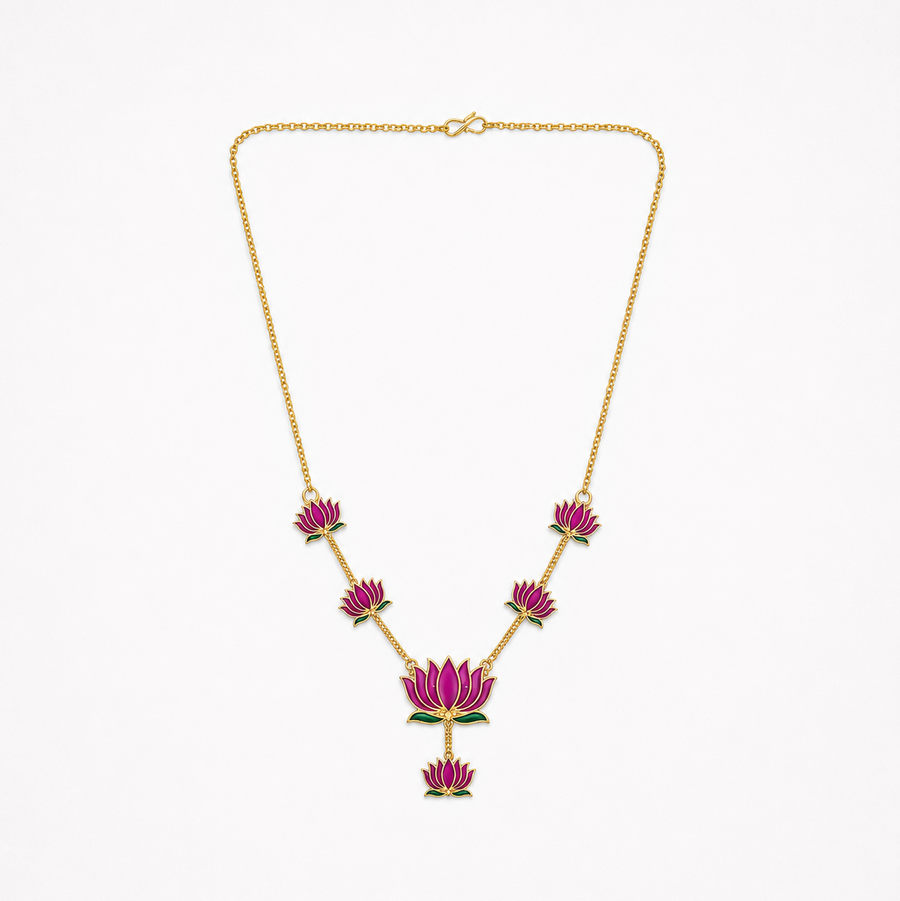 A delicate gold-plated chain necklace featuring multiple magenta-pink enamel lotus motifs arranged along the bottom, centered on a solid white background. Available in the UK at theindianshelf.co.uk.