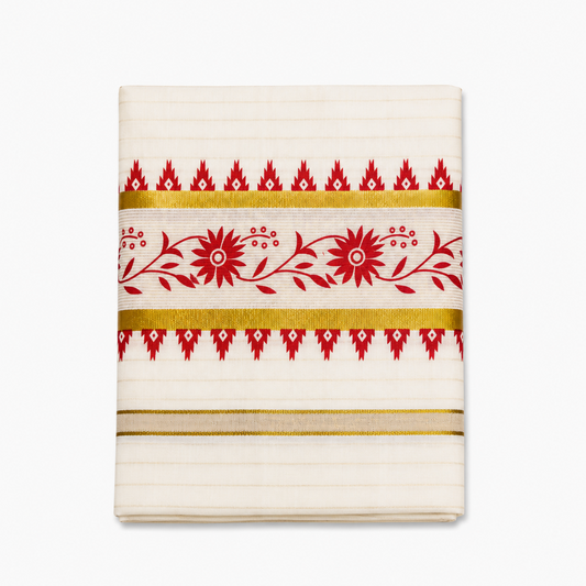 A close-up folded view of an off-white Kerala tissue cotton kasavu set mundu centered on a solid white background, showcasing a horizontal red floral vine motif framed by gold zari bands and red temple edge borders. Available in the UK at theindianshelf.co.uk.