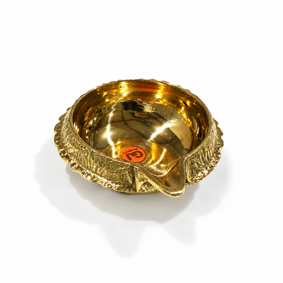 A size 3 traditional brass Lakshmi Kuberar diya featuring a textured outer rim and a polished golden bowl, centered on a solid white background. Available in the UK at theindianshelf.co.uk.