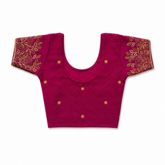 A colorful floral print readymade stretchable saree blouse displayed flat on a solid white background, featuring short sleeves, a scoop neck, and a vibrant pattern of pink, orange, and purple flowers. Available in the UK at theindianshelf.co.uk.