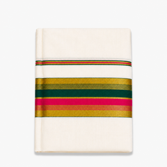 close-up folded view of an off-white Kerala cotton kasavu set mundu centered on a solid white background, displaying horizontal metallic gold zari bands interwoven with vibrant pink and deep green border stripes. Available in the UK at theindianshelf.co.uk.